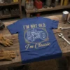 I'm Not Old I'm Classic text with vintage tractor graphic on blue t-shirt