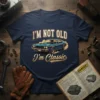 "I'm Not Old I'm Classic" text with a blue vintage muscle car graphic on a navy t-shirt