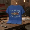 I'm Not Old I'm Classic text with a vintage car graphic featuring flames on a blue t-shirt