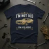 I'm Not Old I'm A Classic quote with a vintage gold muscle car graphic on a navy t-shirt