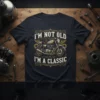 I'm Not Old I'm A Classic text with vintage motorcycle graphic on a navy t-shirt