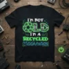 I'm Not Old I'm A Recycled Teenager quote on a black t-shirt with neon green and blue circuit board graphics