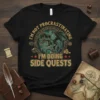 Black t-shirt with "I'm Not Procrastinating I'm Doing Side Quests" text and a green dragon graphic, surrounded by runes