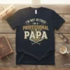 T-shirt with "I'm Not Retired I'm A Professional Papa" text, eagle graphic, and baseball bats