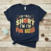Retro graphic tee with text "I'm Not Short I'm Fun Sized" and a smiley face graphic