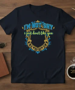 I'm Not Shy I Just Don't Like You quote t-shirt with ornate shield graphic in blue and gold