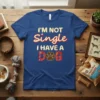 I'm Not Single I Have A Dog text with a paw print graphic on a royal blue t-shirt