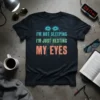 I'm Not Sleeping I'm Just Resting My Eyes quote t-shirt with glowing eye graphic and circuit board design