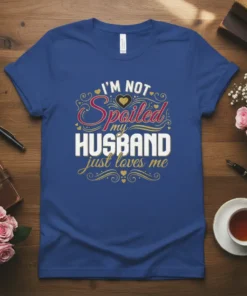 I'm Not Spoiled My Husband Just Loves Me text design on a royal blue t-shirt with decorative hearts and swirls