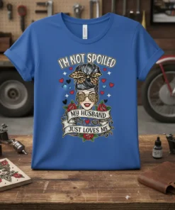 Graphic tee with "I'm Not Spoiled My Husband Just Loves Me" text, featuring a woman with leopard print sunglasses and