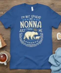 Blue t-shirt with "I'm Not Spoiled My Nonna Just Cloves Me" text and a polar bear with cub graphic, surrounded
