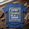 T-shirt with the quote "I'M NOT Spoiled MY PAPAW JUST LOVES ME" in decorative yellow font, featuring an arrow graphic
