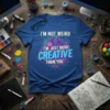 I'm Not Weird I'm Just More Creative Than You quote on a blue t-shirt with circuit board graphics