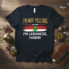 T-shirt with "I'm Not Yelling I'm Lebanese, Habibi" text and Lebanon flag graphic in gold, red, white, and green