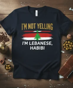 T-shirt with "I'm Not Yelling I'm Lebanese, Habibi" text and Lebanon flag graphic in gold, red, white, and green