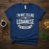 T-shirt with white text "I'M NOT YELLING I'M LEBANESE OK HABIBI?" on a navy blue background
