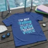 T-shirt with "I'm Not Yelling This Is Just My Swim Coach Voice" in bold blue and white typography, designed for
