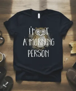 T-shirt with white text "I'm not a morning person" above a sleepy owl graphic