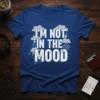 I'm Not In The Mood text design with distressed white font, clouds, and lightning bolts on a royal blue t-shirt