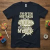 Navy t-shirt with the quote "I'm Often Mistaken For An Adult, Because Of My Age" in bold, retro comic-style lettering