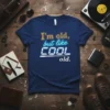 I'm old, but like COOL old. humorous quote t-shirt with retro neon-style lettering