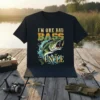 I'm One Bad Bass Uncle text with a leaping bass fish graphic on a black t-shirt, designed for fishing enthusiasts