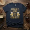 I'M ONLY HERE FOR THE COQUITO. text with two coquito drinks illustration on a navy blue t-shirt