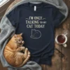 I'm Only Talking To My Cat Today quote with a minimalist cat silhouette graphic on a navy t-shirt