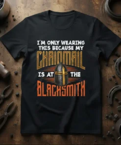 Black t-shirt with white text "I'M ONLY WEARING THIS BECAUSE MY" above "CHAINMAIL" graphic with helmet, and below "IS AT