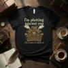 Black t-shirt with gold steampunk typewriter design and text "I'm plotting against you, I'm a writer, it's what to do."