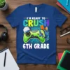 I'm Ready To Crush 6th Grade t-shirt with a green video game controller and school supplies graphic