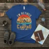 T-shirt with "I'm Retired - Going Camping Is My Job" text, vintage truck, and camper graphic under a sunset