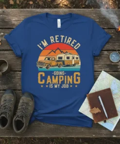 T-shirt with "I'm Retired - Going Camping Is My Job" text, vintage truck, and camper graphic under a sunset