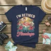 Navy t-shirt with text "I'm Retired My Job Is To Collect Flamingo" and a graphic of a flamingo in a