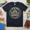I'm Retired Now I Work For My Grandkids quote on a navy t-shirt with playful graphics of children playing