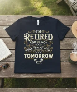 I'M RETIRED YOU'RE NOT HAVE FUN AT WORK TOMORROW quote on a navy t-shirt, featuring vintage typography and a beach