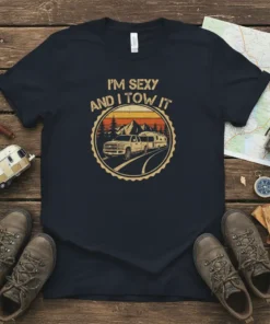 I'm Sexy And I Tow It t-shirt featuring a retro graphic of a truck towing a camper trailer with mountains