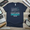 T-shirt with the text "I'm Silently Creating A Spreadsheet For That" in white and teal, featuring a spreadsheet graphic and