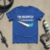 Blue t-shirt with white text "I'M SILENTLY JUDGING YOUR WALKWAY" above a graphic of a pressure washer cleaning a walkway