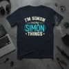 I'm Simon Doing Simon Things quote on a navy t-shirt, featuring bold white and blue typography
