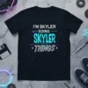 Black t-shirt with white and cyan text: "I'm Skyler Doing Skyler Things" in a modern, tech-inspired font