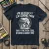 I'm So Good At Catching Fish That The Fish Tell Stories About Me quote t-shirt with a bass fish graphic