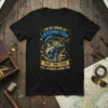 I'm So Good at Catching Fish That The Fish Tell Stories About Me quote on a black t-shirt with a