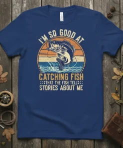 I'm So Good At Catching Fish tee featuring a bass leaping from water with vintage sunset graphic and humorous quote