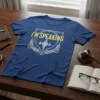 Blue t-shirt with yellow text "I'M SPEAKING" inside a silver emblem featuring a sound wave and laurel leaves, representing legal