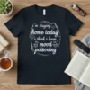 Black t-shirt with white text: "i'm staying home today i think i have mood poisoning" and small graphics of clouds