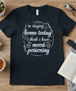 Black t-shirt with white text: "i'm staying home today i think i have mood poisoning" and small graphics of clouds