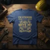 Blue t-shirt with gold text "I'm Sticking With My Solidarity" featuring a fist and gear graphic, symbolizing labor pride