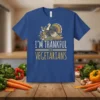 I'm Thankful For Vegetarians t-shirt with a graphic of a turkey on corn and autumn leaves. The text is in