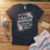 T-shirt with white text "I'm That Crazy Mawmaw Everyone Told You About" surrounded by pink flowers and green leaves